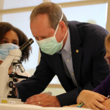 Congressman Murphy examining a microscope with some students from eastern North Carolina.